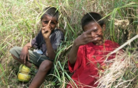 At Oeiburu, we’re assigned two young guides for $10 each, plus $20 for the village to look after the car. The boys speak Makassae, a different dialect from the Tetun we’re learning in Dili. They dart ahead in jandals, chatting and occasionally breaking into song. They’ve got none of our flash walking gear, snacks, electrolyte solution or water bottles, though one has a pouch cut from a rice sack containing a catapault and knife.