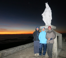 After a damp snooze in the run-down Pousada, we're up at 3am to start our climb. It's a two-hour slog in the dark: stone steps for the first 30 minutes, then a dirt track. The top's clear but freezing and the beanies come into their own. From left: Julia, me and Del.
