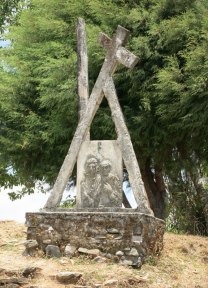 Religious icons like this Station of the Cross outside Letefoho church are commonplace in Catholic Timor.