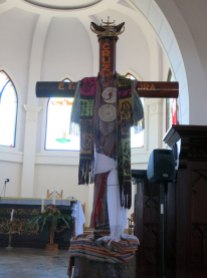 Woven tais and a traditional head piece draped over a crucifix are the only Timorese trappings in the cathedral.